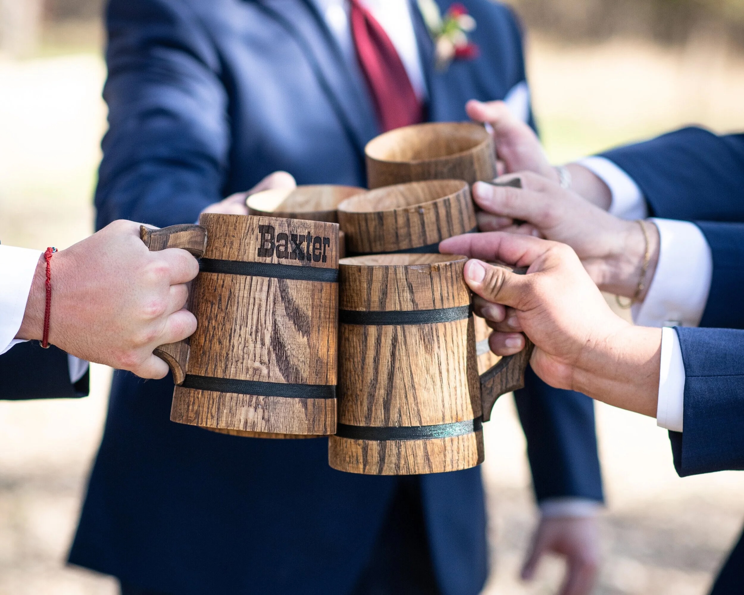 Authentic Hill Country cheers with beer mugs at a Texas wedding celebration
