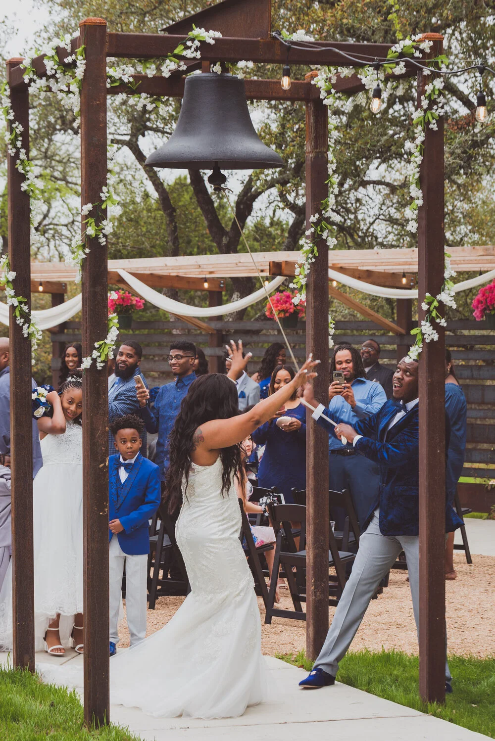 A celebratory wedding portrait at a Hill Country venue